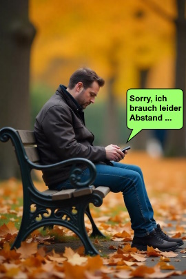 Mann auf Parkbank im Herbst schreibt Nachricht am Handy